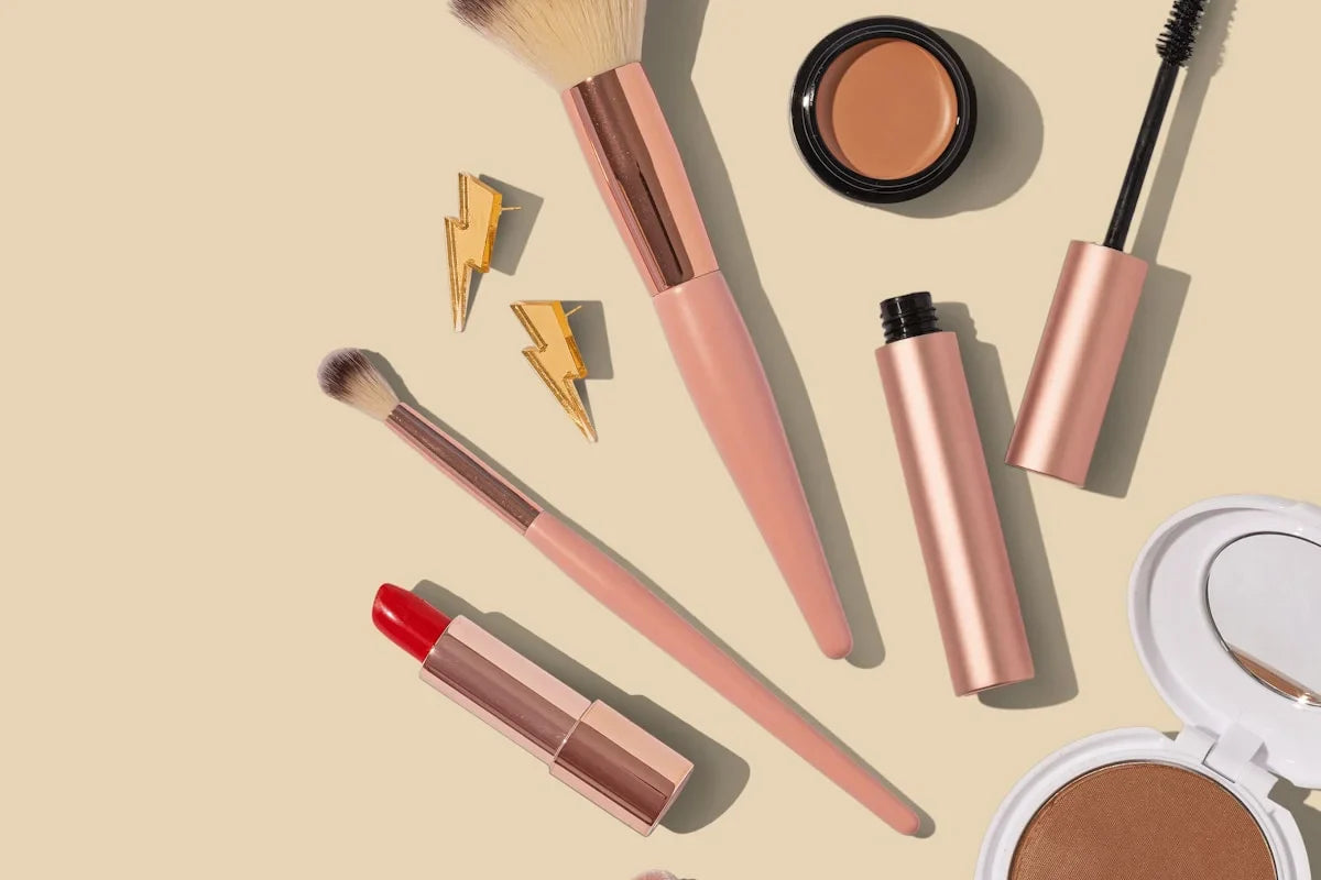 Stylish cosmetic and toiletry bags with makeup products and beauty essentials
