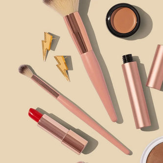 Stylish cosmetic and toiletry bags with makeup products and beauty essentials
