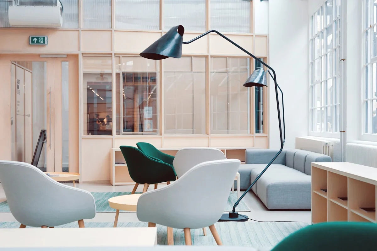 Modern office furniture including desks, chairs, and workspace essentials