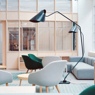 Modern office furniture including desks, chairs, and workspace essentials